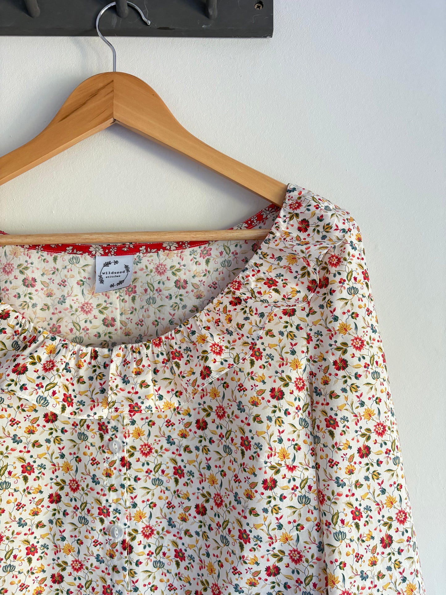 Peony ruffle neck blouse with Bracelet length sleeves
