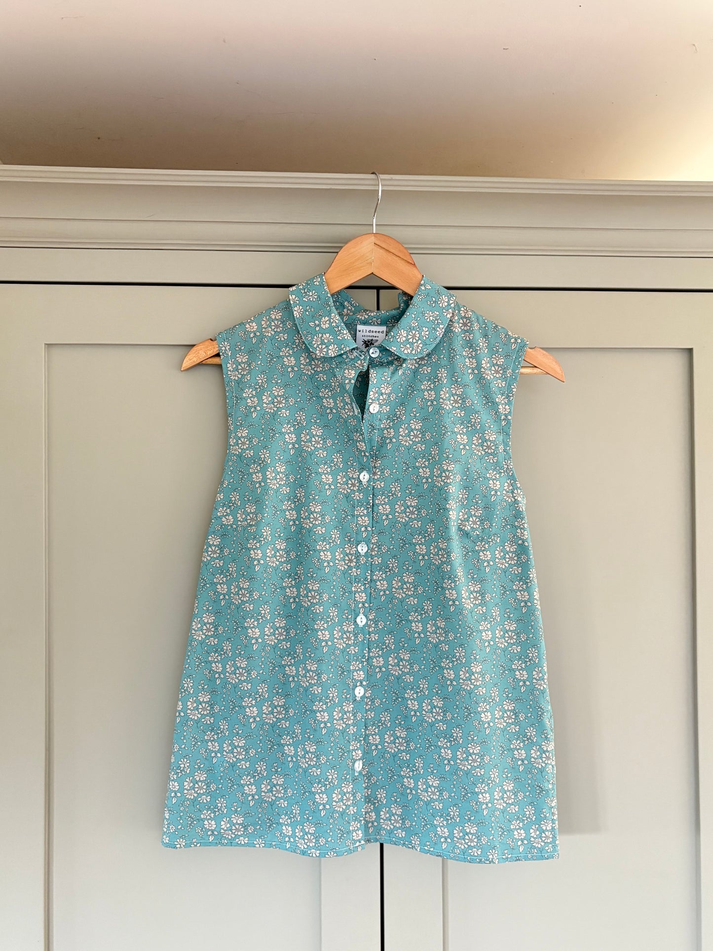 Dewberry Sleeveless Blouse