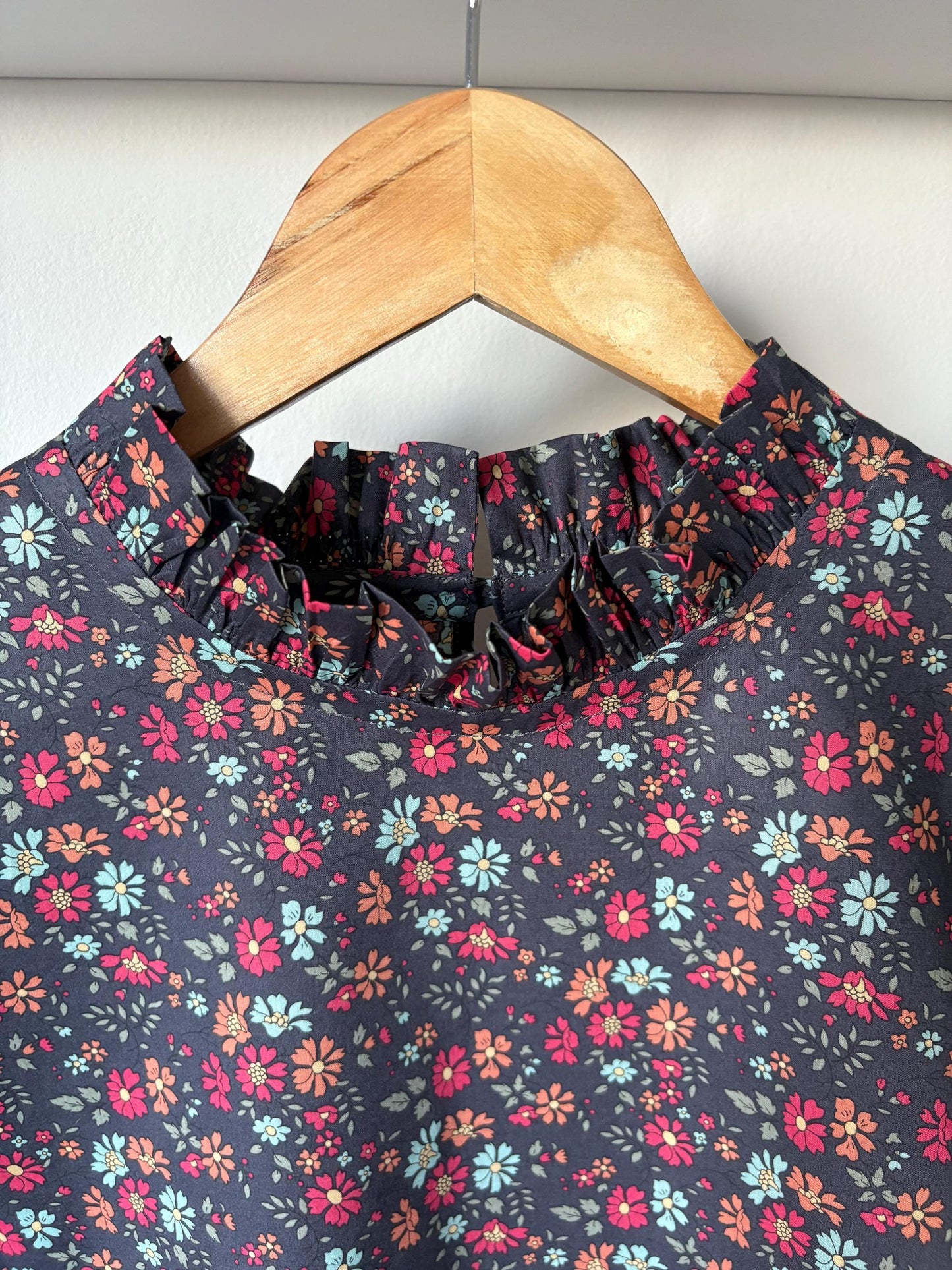 Blouse with ruffle collar, 3/4 sleeve and ruffle cuffs. Hand made to order in Liberty of London print cotton Tana Lawn.