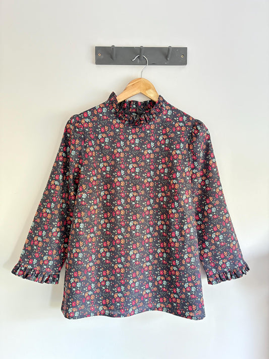 Blouse with ruffle collar, 3/4 sleeve and ruffle cuffs. Hand made to order in Liberty of London print cotton Tana Lawn.